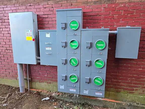 Multi-family 7-gang meter bank installation on brick building